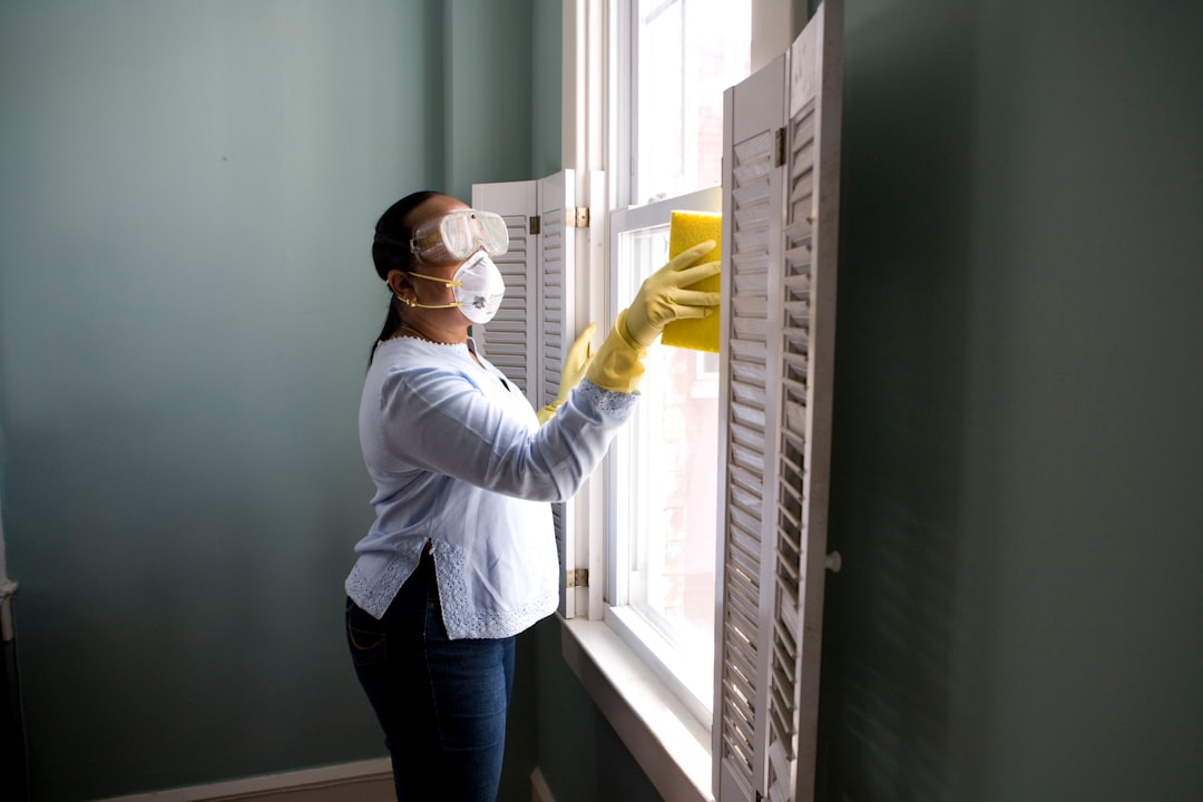 get-in-touch When renovating a home, you should use a damp sponge or cloth to clean dust collected on a window sill, as the dust may contain asbestos or lead-based paint. Home maintenance is an ongoing process for any homeowner, and here we see an African- American woman who’d taken a damp sponge to her window’s frame, in order to remove accumulated dust particulates. Note how the homeowner had donned a pair of waterproof gloves, a facemask, and a pair of goggles, prior to beginning this task.